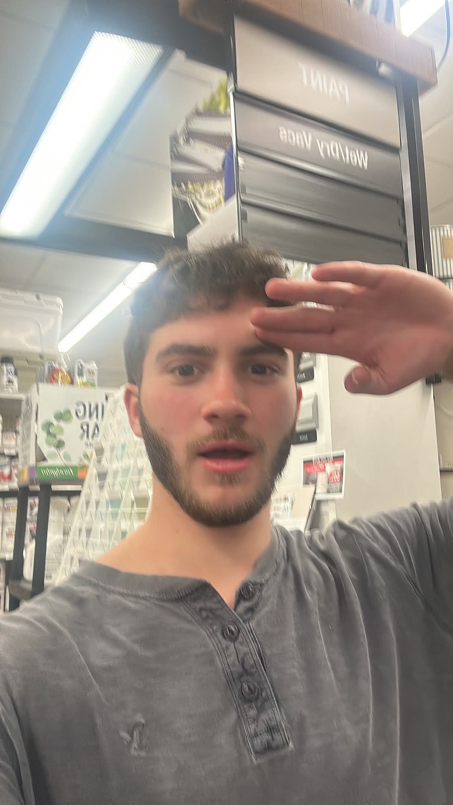 Sruly saluting in a hardware store